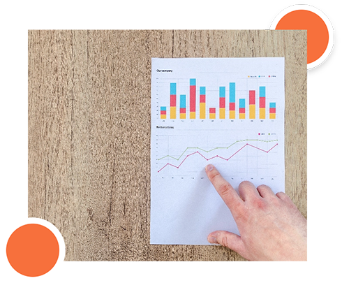 Person analyzing a report with charts, focusing on project documentation details.