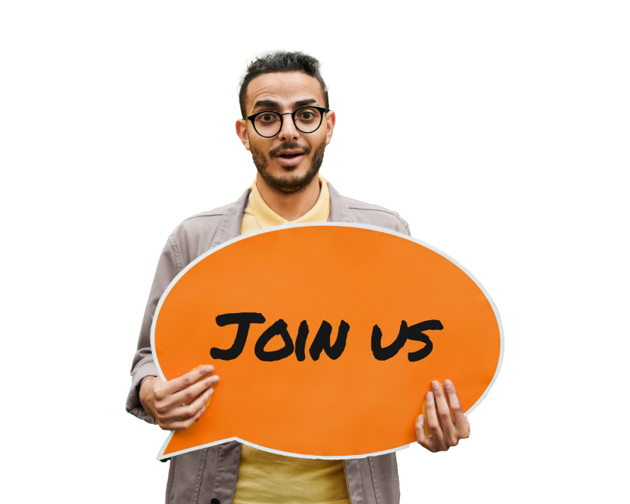 Man smiling and holding an orange sign that says 'Join Us,' inviting talent to apply.