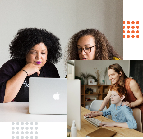 Two women using laptops while a mother and child engage with a computer together.